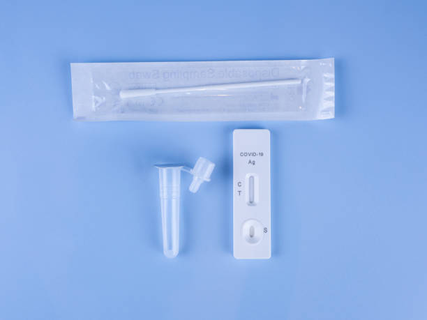 istock Antigen test kit for self-testing on isolated blue background. Covid-19 antigen test kit. Copy space blank area for text. New and unused ATK. 1386208868