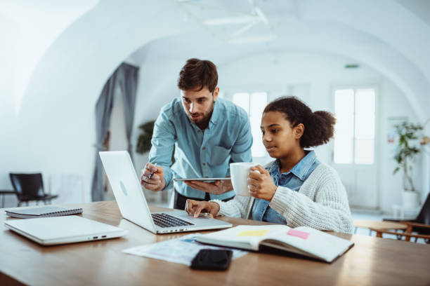 istock Young entrepreneurs working together in office 1386209514