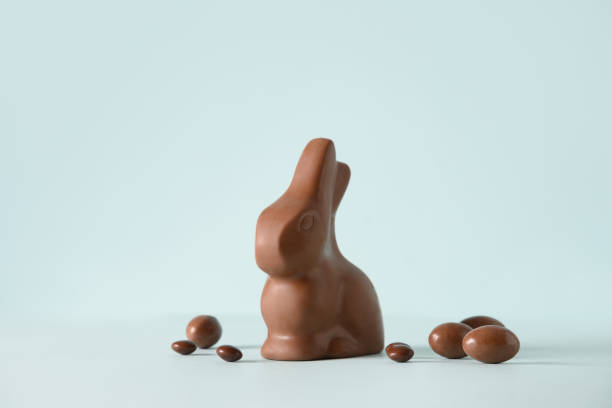 istock Easter greeting card with chocolate rabbit figure and eggs. 1386211520
