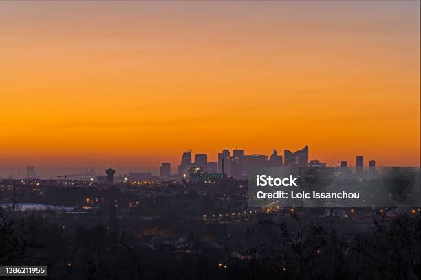 Orange Sky Over La Defense Business District At Sunrise With Sacred Heart Basilica Stock Photo - Download Image Now
