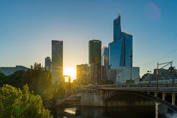 Sun Shine Over La Defense Business District Skyline With Seine River Timelapse - Sun Shine Over La Defense Business District Skyline With Seine River. Find more images of LA DEFENSE on my profile. city zoom out stock pictures, royalty-free photos & images