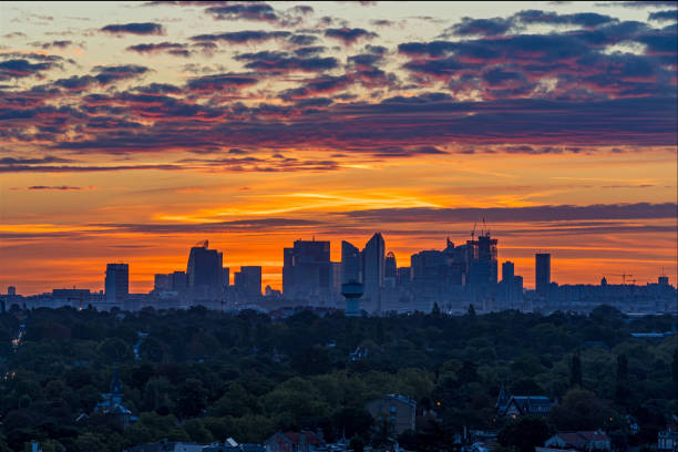 istock Orange Sky at Sunrise Over La Defense District With Silhouette Skyline 1386214264