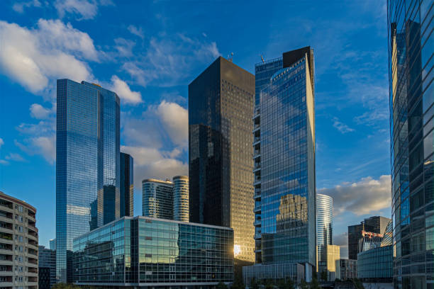 istock Sunny and Cloudy Sunset Over La Defense Business District Buildings Reflections 1386214515