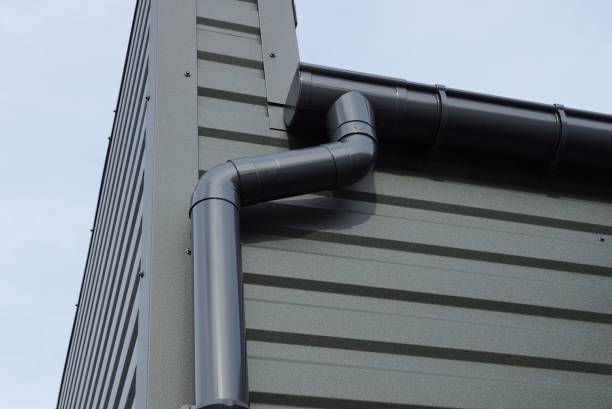 istock long black plastic drain pipe on the iron wall of the building 1386216701