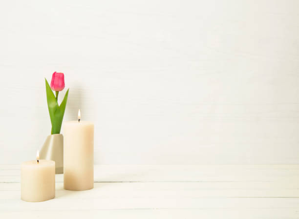 istock candles and flower on a white background 1386216857