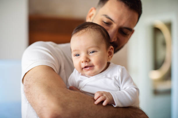 istock Father enjoying time with his baby boy at home 1386223313