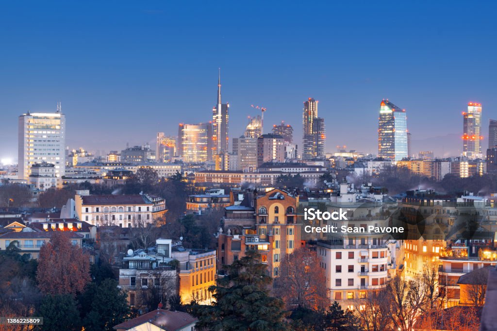 Milan, Italy Financial District Milan, Italy financial district skyline over residential apartments at dusk. Milan Stock Photo