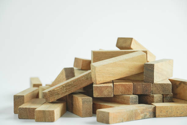 istock Wood block stack for architecture model and concept of business risk management for strategy plan. 1386228526