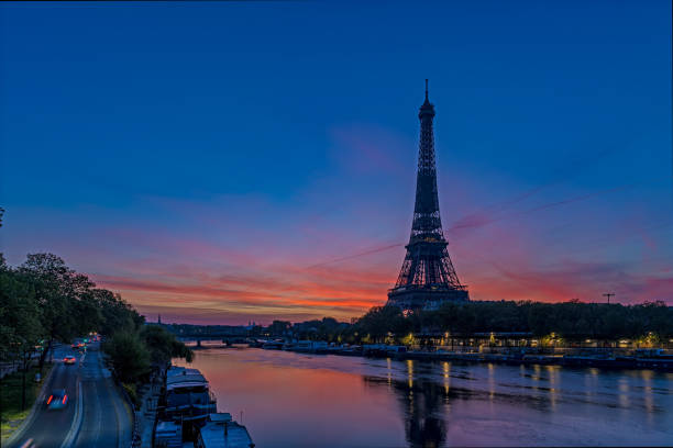 istock Red Sky at Sunrise Over Paris and Eiffel Tower With Seine River and Traffic 1386228568