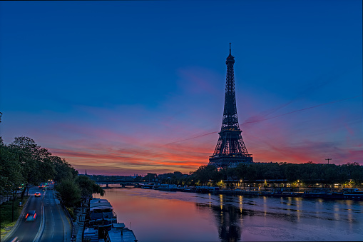Timelapse - Red Sky at Sunrise Over Paris and Eiffel Tower With Seine River and Traffic. Find more images of PARIS on my profile.