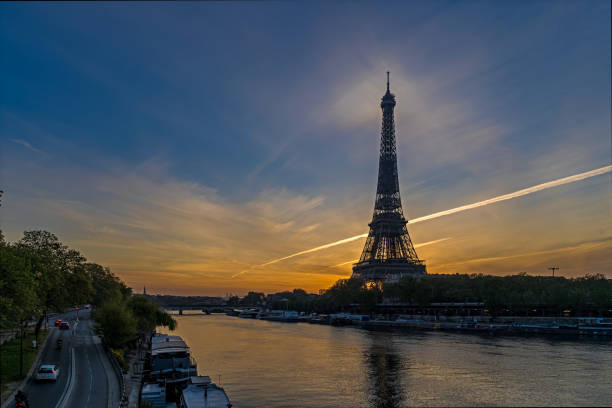 istock Golden Hour and Orange Sky Over Paris Eiffel Tower Seine River and Traffic 1386228605