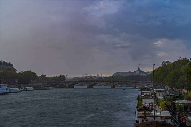 istock Rain Over Paris and Seine River With Wind and Trees 1386231063
