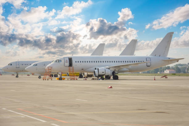 istock Three different types of aircraft lined up on the airport apron. 1386231677