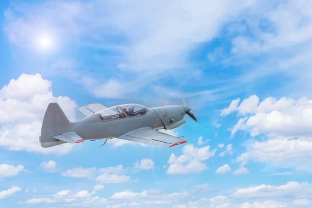 istock Single-propeller aircraft flying over the blue sky. 1386232250