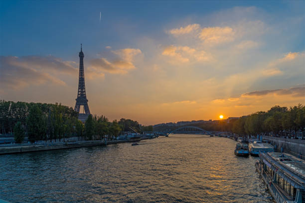 istock Golden Hour in Paris at Sunset With Eiffel Tower and Seine River Trees on Docks 1386232629