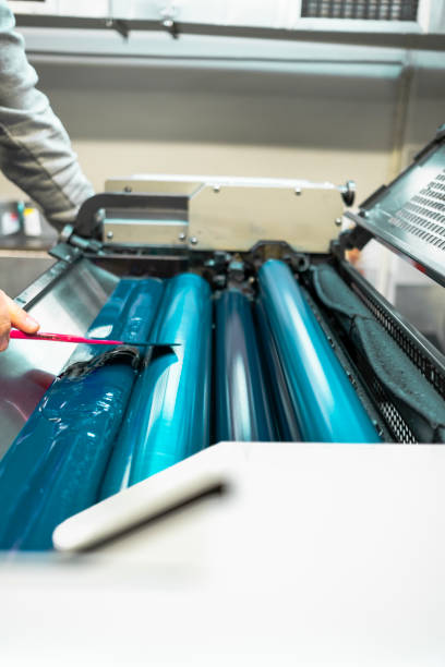 istock Color and glossy rollers of offset printing machine. Spot Blue 1386232689