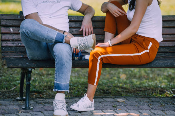 Young affectionate couple embracing in park in autumn
