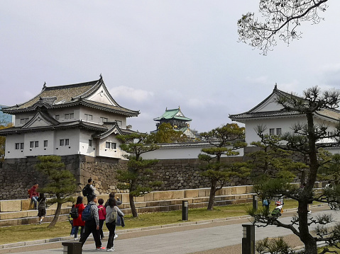 Osaka, Japan - Dec 30, 2022 : People sightseeing at Osaka castle in Osaka, Japan on Dec 30, 2022.