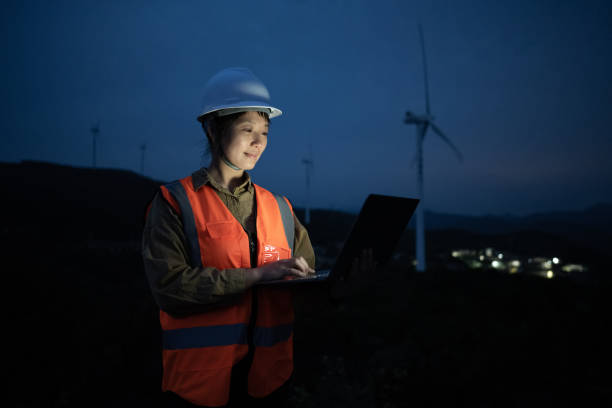 istock A young Asian female engineer working on wind energy on a laptop 1386238431