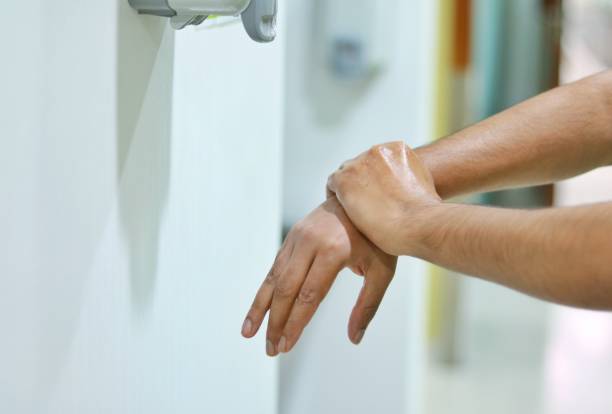 istock A healthcare worker rubbing the wrist with alcohol-based hand rub 1386240026