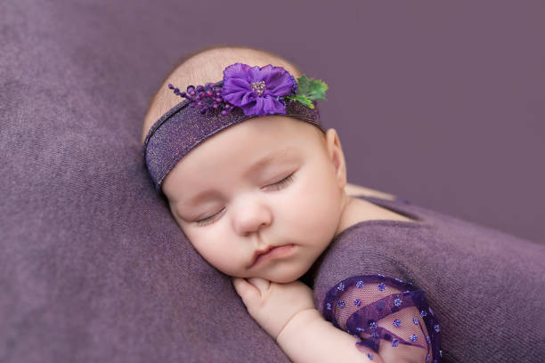 Newborn baby sleeping sweetly with his hands under his cheek. Newborn baby sleeping sweetly with his hands under his cheek. 8 weeks stock pictures, royalty-free photos & images