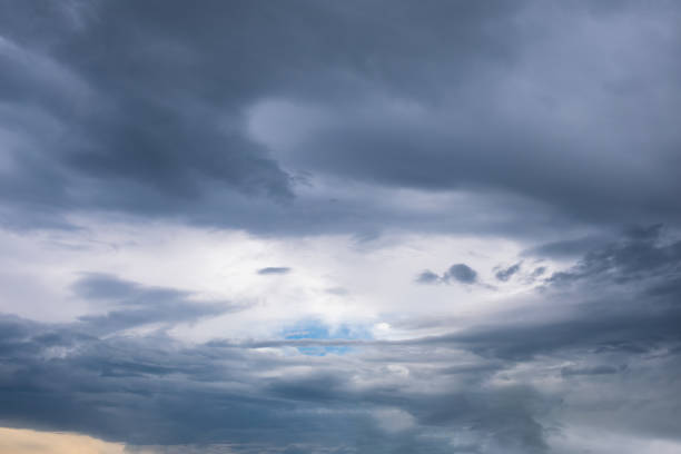 istock Gloomy stormy sky with thick gray clouds, cloudscape natural background 1386246213
