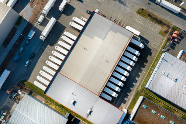 istock Distribution logistics building parking lot - aerial view 1386246301