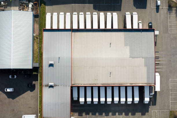 istock Distribution logistics building parking lot - aerial view 1386246311