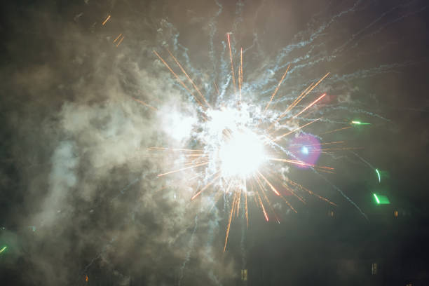 istock Beautiful colorful fireworks against a dark sky background. Selective focus, background, texture 1386249751