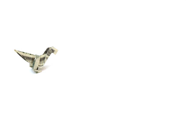 istock dollar Dinosaur origami 1386250887