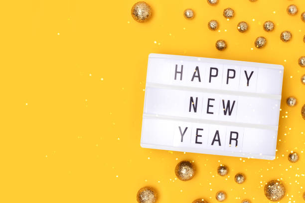 istock Happy New Year. Lightbox and golden round glittering confetti. 1386251130