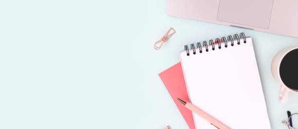 istock Banner with workspace with laptop and office supplies on a blue background. 1386252796