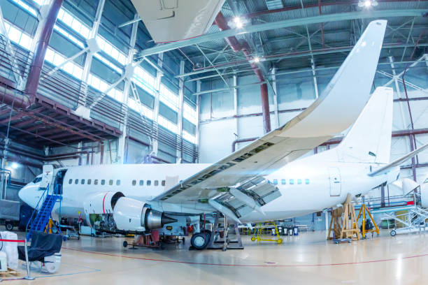 istock White passenger airliner in the hangar. Aircraft under maintenance 1386255228