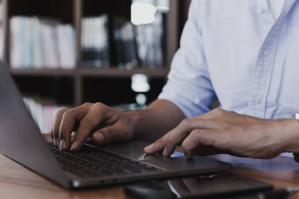 istock Young businessman working with laptop at home office. 1386255400