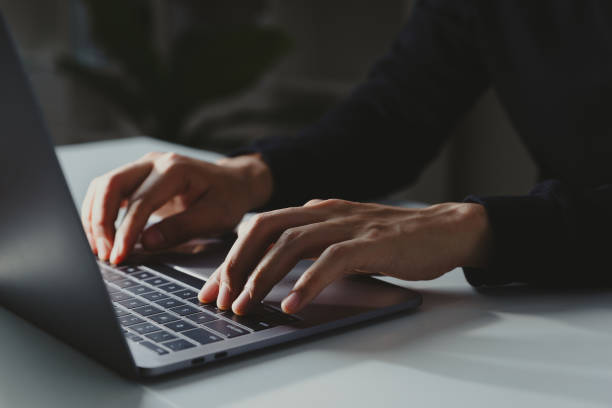 istock Young businessman working with laptop at home office. 1386255518