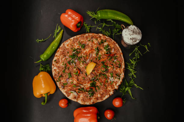 Turkish Pizza on Big Serving Plate With Rice and Salad, Decorated Serving. Turkish Cuisine Pizza Plate stock photo