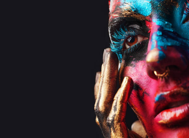 cropped shot of an attractive young woman posing alone in the studio with paint on her face - beautiful confidence bizarre exoticism imagens e fotografias de stock