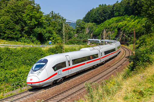 High speed train driving on railroad track.
