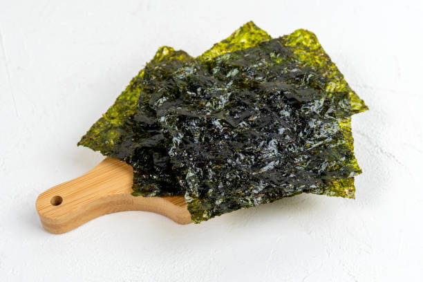 istock Thin dried sheets of nori seaweed snack, close up 1386262959
