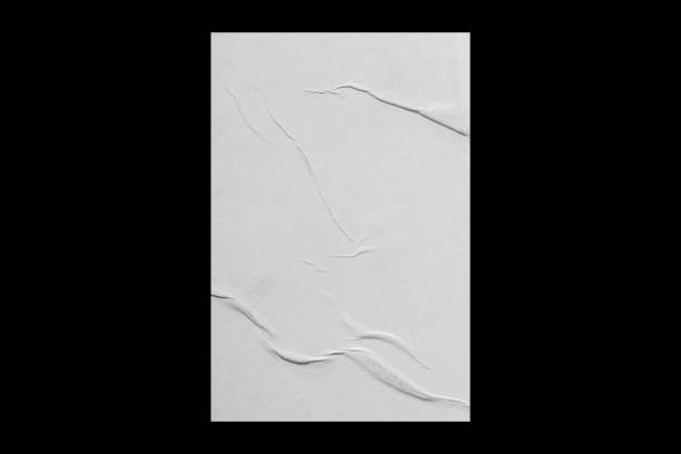 istock Sheet of crumpled paper isolated on black background. 1386266513