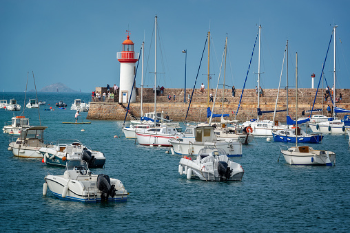 Sète is located in the region of Occitania, southern France. The image shows the lighthouse and a commercial dok, captured during  spring season.