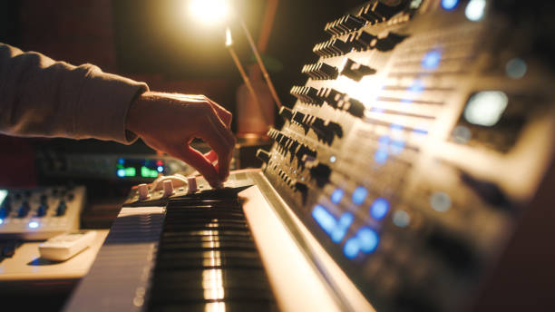 istock Hands of a man sound engineer are pressing buttons on the console 1386266963