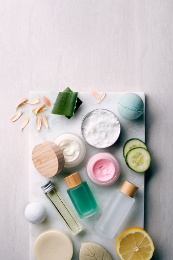 Natural cosmetics on a marble surface with copy space.
