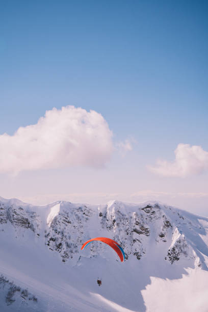 istock Paraglider on the background of mountains 1386270016