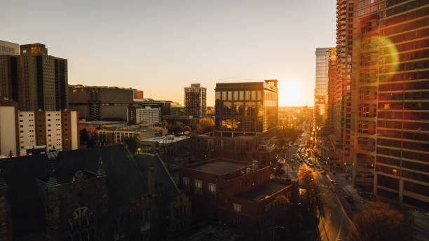 istock sun flare hits a skyscraper and traffic is visible below 1386271859