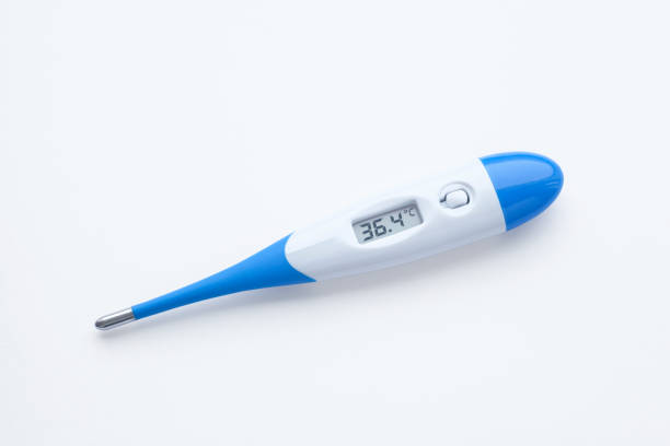 A blue, white medical digital thermometer display 36,4 degrees celsius on white background. The ideal body temperature for adults is 36 - 37 °C (clipping path included)