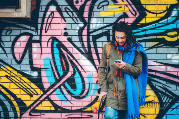 istock Young man with dreadlocks enjoys music 1386281502