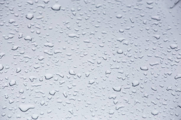 istock water drops on grey glass surface, full-frame closeup background with selective focus 1386282428