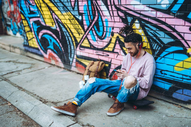 istock Graffiti artist listens to music 1386282480