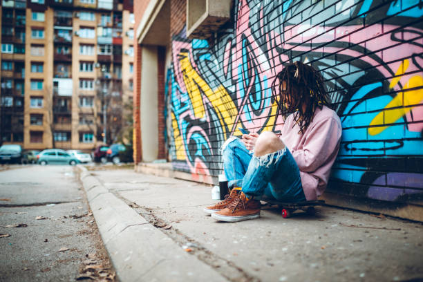 istock Graffiti artist listens to music 1386282501